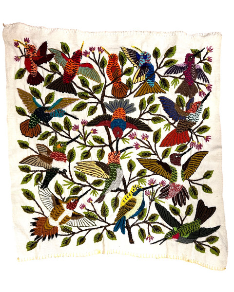 Exquisite hand embroidered panel of hummmingbirds. This is new embroidery by one of the talented artisans we work with in Santiago Atitlan, Guatemala. There is a mix of birds with grass, branches and leaves. The embroidery is in various colors. The fabric is handwoven natural white cotton. This could be framed and hung on the wall or made into a pillow. We can't get over how beautiful these embroideries are. One of a kind. 

