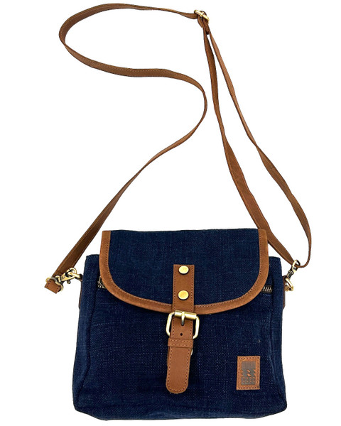 Handmade burlap and leather unisex shoulder bag. Burlap or Jute is a traditional fabric from Bengal. This group is reviving the use of this natural fiber while supporting talented local artisans in the community with good jobs and a fair wage. This one of the best hand crafted bags we've seen in a long while. Burlap, leather. Color: deep indigo blue. Inside charcoal woven cotton. Red Brown leather strap and trim. We are excited to be representing this group. 