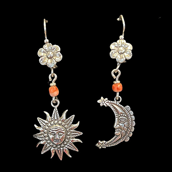 Handmade sterling earrings by a talented family of silversmiths in Peru. Silver sun and moon and a flower. Coral colored bead. We purchased these directly from this family. We love their work! 