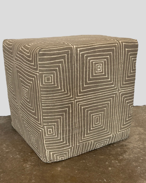 Hand printed cotton cloth made into a comfortable cube ottoman. Colors grey and creamy white. 