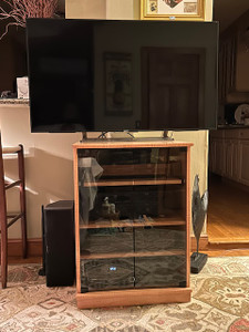 Gray glass doors on the Narrow Tv stand with Glass Doors 33" High  in Colonial Maple on maple finish.
(805) 331-8506 https://www.decibeldesigns.com