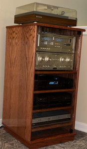 50" stereo cabinet  shown in  Red Chestnut with clear glass doors.
https://www.decibeldesigns.com  telephone 805.331.8506 