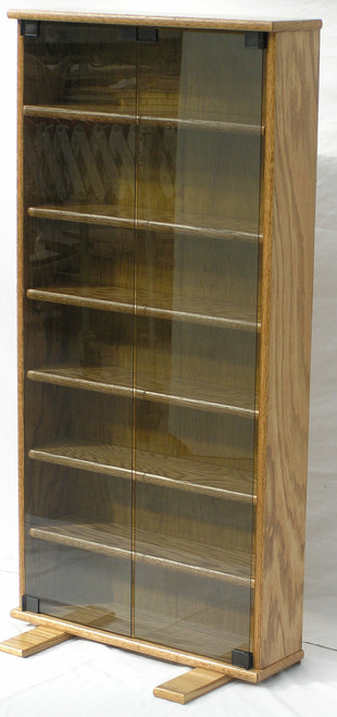 DVD storage cabinet 48"H shown in Minwax Golden Oak with gray glass doors. decibeldesigns.com 888.850.5589