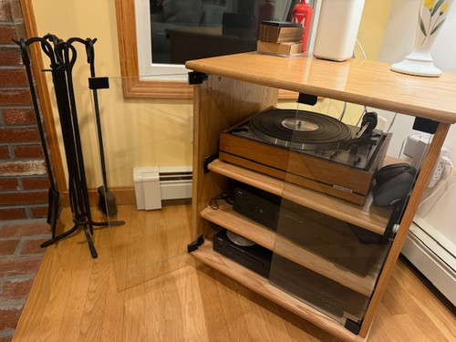 Stereo center 27" high with clear glass doors. Shown in oak with a clear finish.  2 adjustable shelves standard.  Optional sliding shelf also shown. https://www.decibeldesigns.com 888.850.5589
