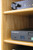 Adjustable shelf close up. Stereo cabinet 53" high shown in natural oak.  http://www.decibeldesigns.com  telephone 888.850.5589