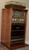 Narrow Stereo Cabinet 50"H  shown in  Red Chestnut.
https://www.decibeldesigns.com  telephone 805.331.8506 
