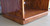 Stereo center with Glass Doors 27" shown in custom Minwax Wood Finish Gunstock Oak 231. Cabinet bottom trim hides 6 dual wheel non marking casters.  https://www.decibeldesigns.com 888.850.5589