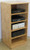 Stereo cabinet 50" high shown in natural oak.Oblique view of top.  https://www.decibeldesigns.com  telephone 808.331.8506