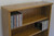 Top close up view of DVD shelves 60" high shown in light brown oak. decibeldesigns.com 888.850.5589
