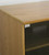 Audio cabinet with glass doors 73 inches high top corner detail shown in light brown oak. http://www.decibeldesigns.com 888.850.5589