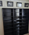 Black DVD racks 72" high. 3 side-by-side.
805 331-8506 decibeldesigns.com