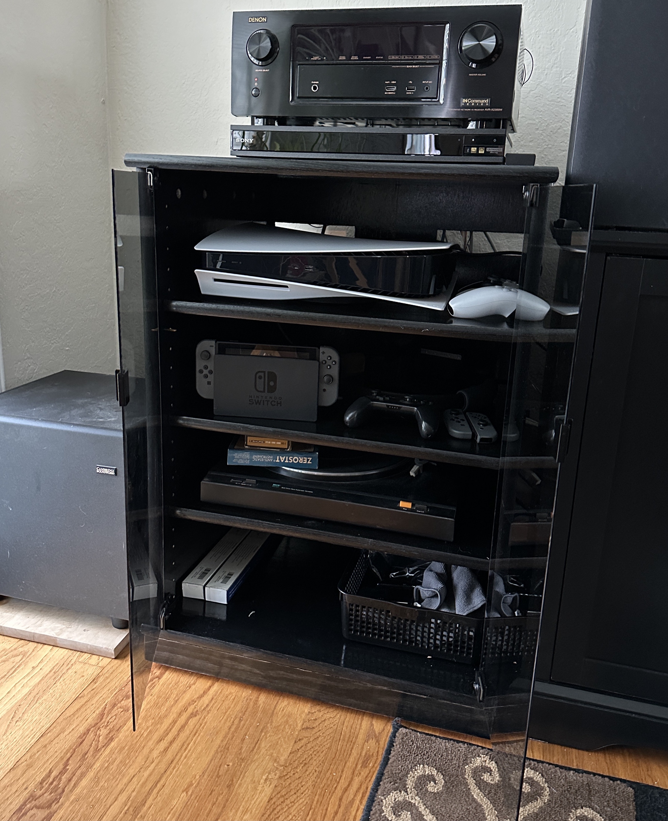 Black oak SC2230 audio cabinet with gray glass doors.