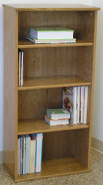 Wall shelves 49 inches high with three adjustable shelves. Shown in light brown oak finish. Glass doors available. Stores hardbound books, LP's, and lazer discs. 23" wide all formaldehyde free plywood construction. Available in Oak or Maple unfinished or with standard or custom finishes.Simple assembly. Matching CD DVD cabinets and stereo cabinets. We're here to create quality for you!  http://www.decibeldesigns.com  telephone 888.850.5589