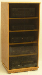 Stereo cabinet 50 inches high with gray tint glass doors. 1 pair full length tempered glass doors. 4 adjustable shelves.  Shown in light brown oak with satin sheen top coat. http://www.decibeldesigns.com 888.850.5589