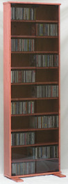 DVD rack 72 inches high with gray tempered glass doors. 10 adjustable shelves. Shown in Maple with Minwax Sedona Red finish 888.850.5589 decibeldesigns.com