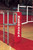 VB-1100 Aluminum Pro Series Elite Aluminum Volleyball System - Shown with optional VB72 official's stand and VB77P official's stand padding.