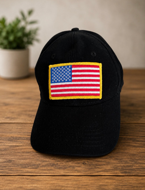 BLACK CAP WITH EMBROIDERED FLAG PATCH OUTLINED IN YELLOW