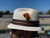 Natural Stingy Pinchfront Milano. Shown with brim down.