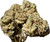 A wider shot of Legendary Kush, showing off the compact bud structure and vibrant coloration. This image reveals the earthy, rugged texture that speaks to its potency.