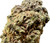 Another angle of the Runtz OG bud, highlighting its thick trichome layer. This shot emphasizes the texture, with clusters of crystals covering the entire surface, indicating high potency and a well-cured flower.