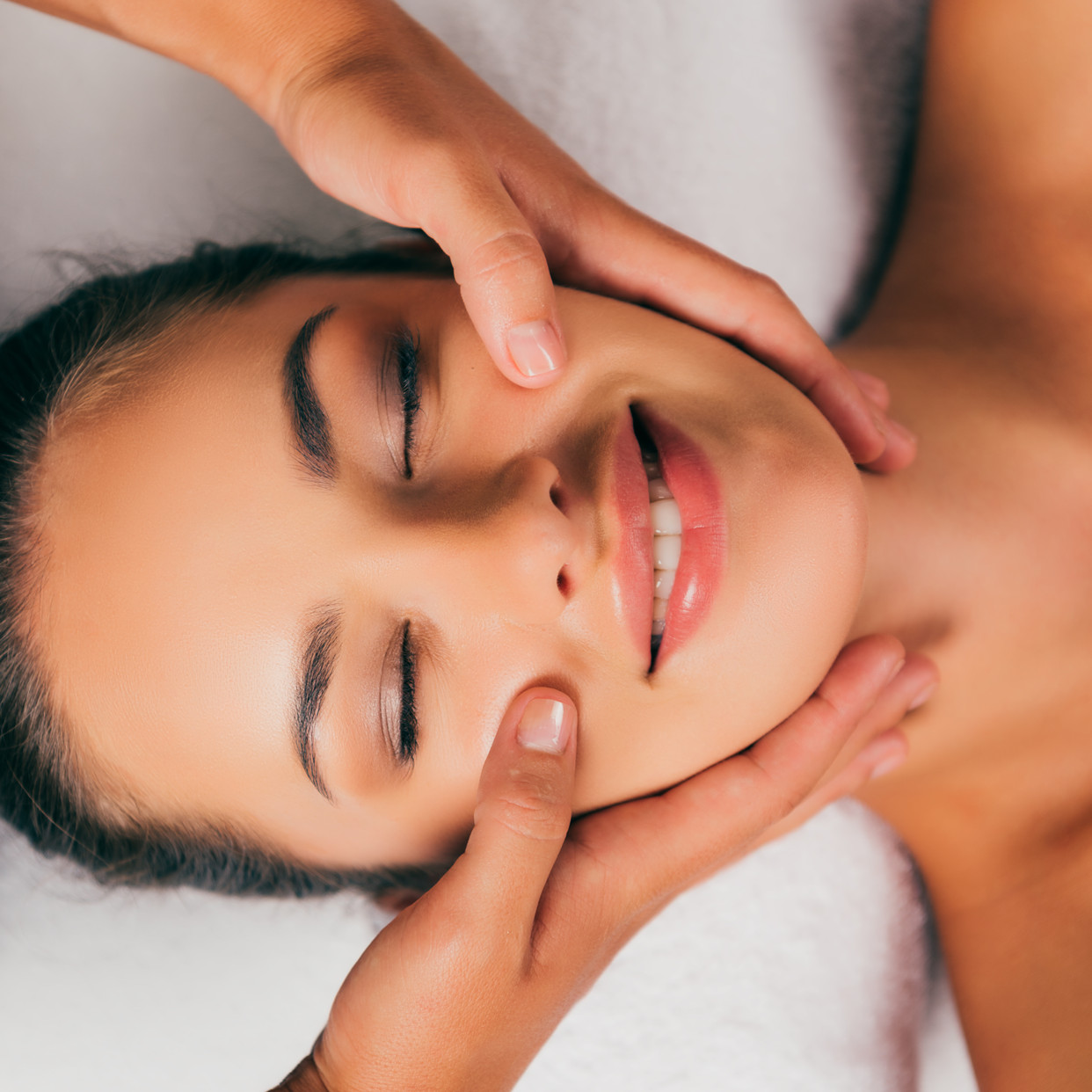 beautiful woman having a facial massage treatment in a day spa in camden nsw australia