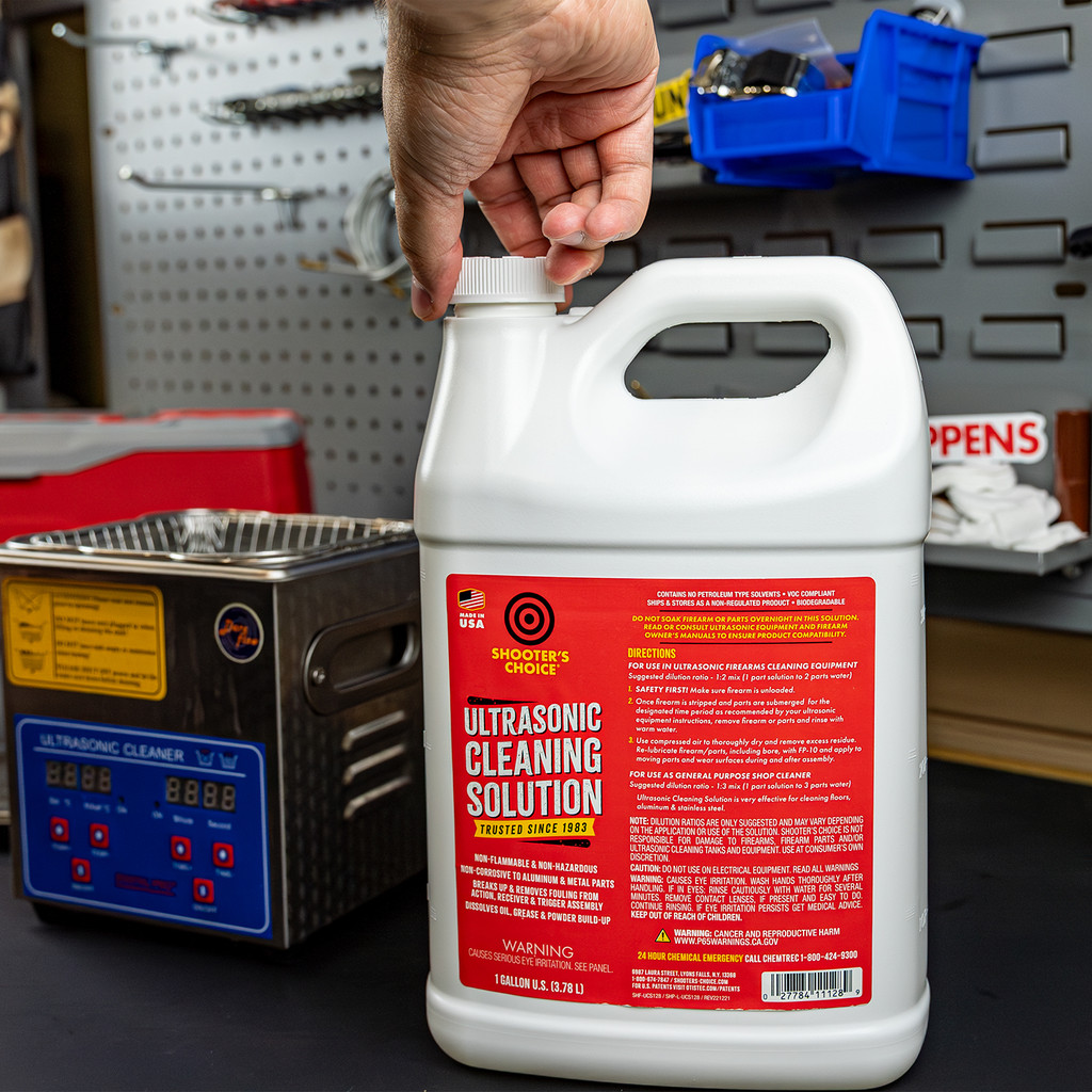 LIfestyle image of man opening shooter's choice ultrasonic cleaning solution