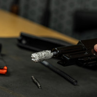 Product lifestyle image of Shooter's Choice .45cal bore mop in use on a Hi-Point JHP 45 pistol