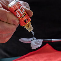 Lifestyle image of Shooter's Choice FP-10 Lubricant Elite CLP .5oz in use on gun cleaning patch