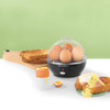 Black electric egg cooker with cooked eggs, poacher, and toast for breakfast