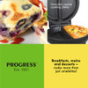 Black omelette maker with indicator lights, shown cooking two filled omelettes.