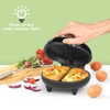 Black omelette maker with indicator lights, shown cooking two filled omelettes.