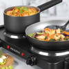 Black double hot plate with two hob rings, shown cooking in a kitchen setting