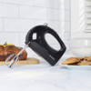 Black hand mixer with chrome beaters, Progress brand, side view