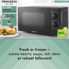 Black manual microwave with 20 litre capacity and 700W power, shown on kitchen counter.