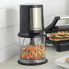 Progress electric food chopper with diced vegetables in bowl, shown on kitchen counter