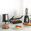 Progress black food chopper, panini grill with sandwich, and blender with fruit on kitchen counter