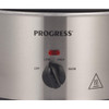 Stainless steel slow cooker with visible cooked meal, hand lifting glass lid.