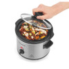 Silver and black electric slow cooker with open lid shown from above