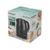 Black electric kettle with textured design on kitchen worktop, next to mug and cupcakes.