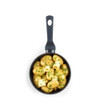 Small boiled potatoes with parsley and curls of butter in a black saucepan, overhead view.