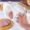 White electric egg cooker on kitchen shelf