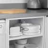 White electric egg cooker on kitchen shelf