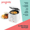 White Progress deep fryer with basket of chips in kitchen, shown with assorted fried foods.