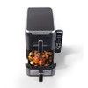 Black dual air fryer baskets with racks and crisper trays shown separately, top view