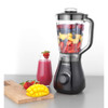 Black Progress blender with jug containing pink smoothie, shown on a white background