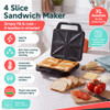 Black sandwich maker with two toasted sandwiches, hand opening lid.
