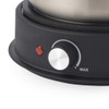 Black electric hot plate temperature control dial and indicator light close-up