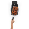 Fryer basket with cooked fried chicken portions held above a black electric deep fryer