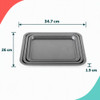 Silver non-stick baking tray, oblique side view, shown on white background