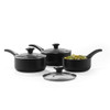 Set of three black saucepans with glass lids, one with pasta inside